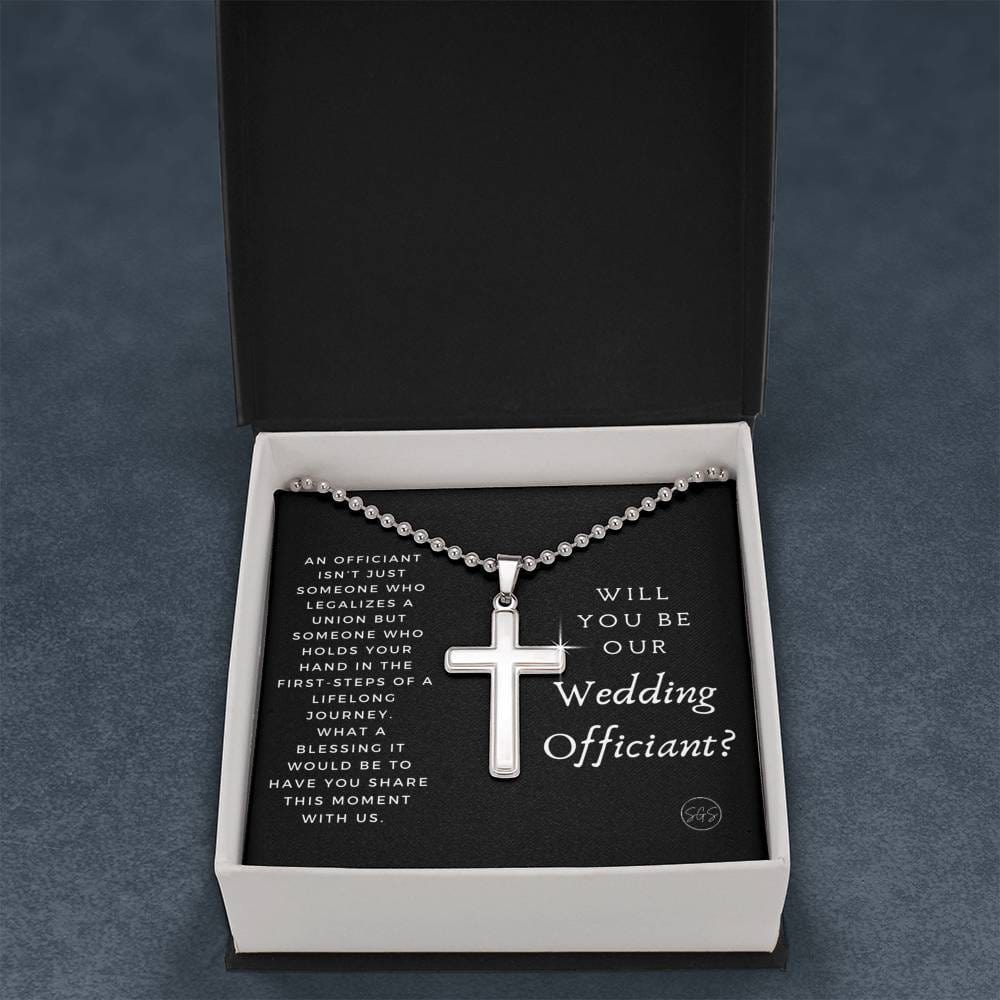 officiant prop holds hand black cross