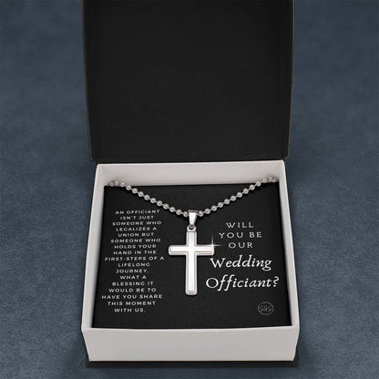 officiant prop holds hand black cross