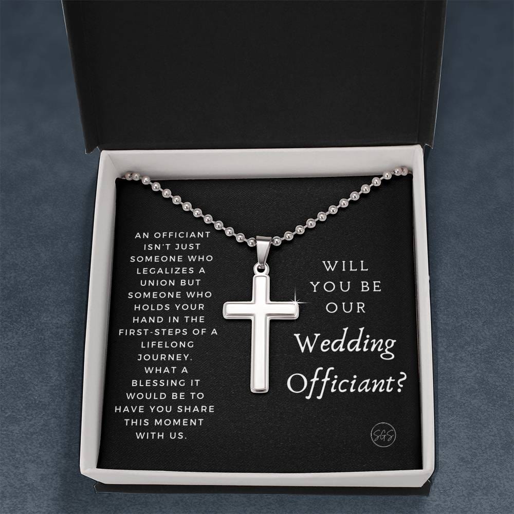 officiant prop holds hand black cross