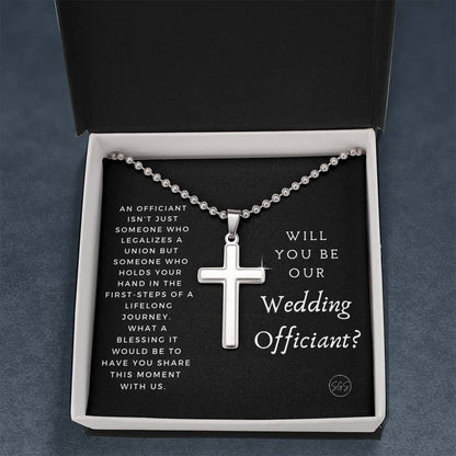 officiant prop holds hand black cross