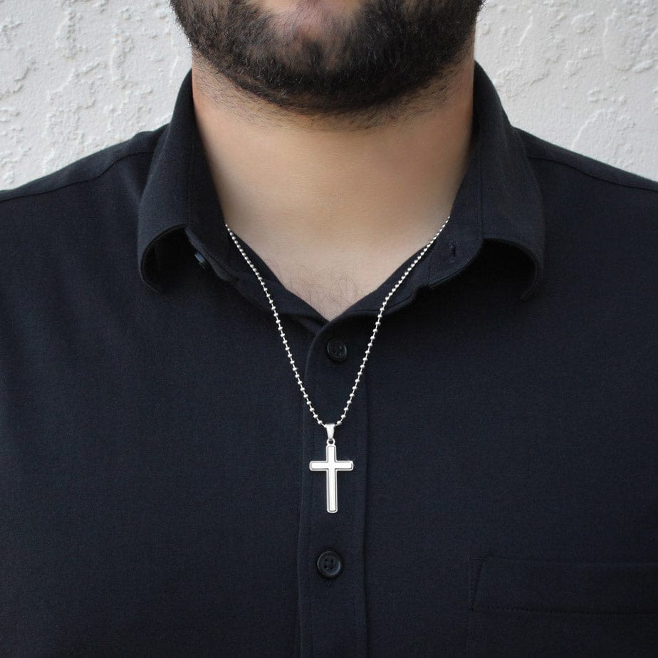 officiant prop holds hand black cross