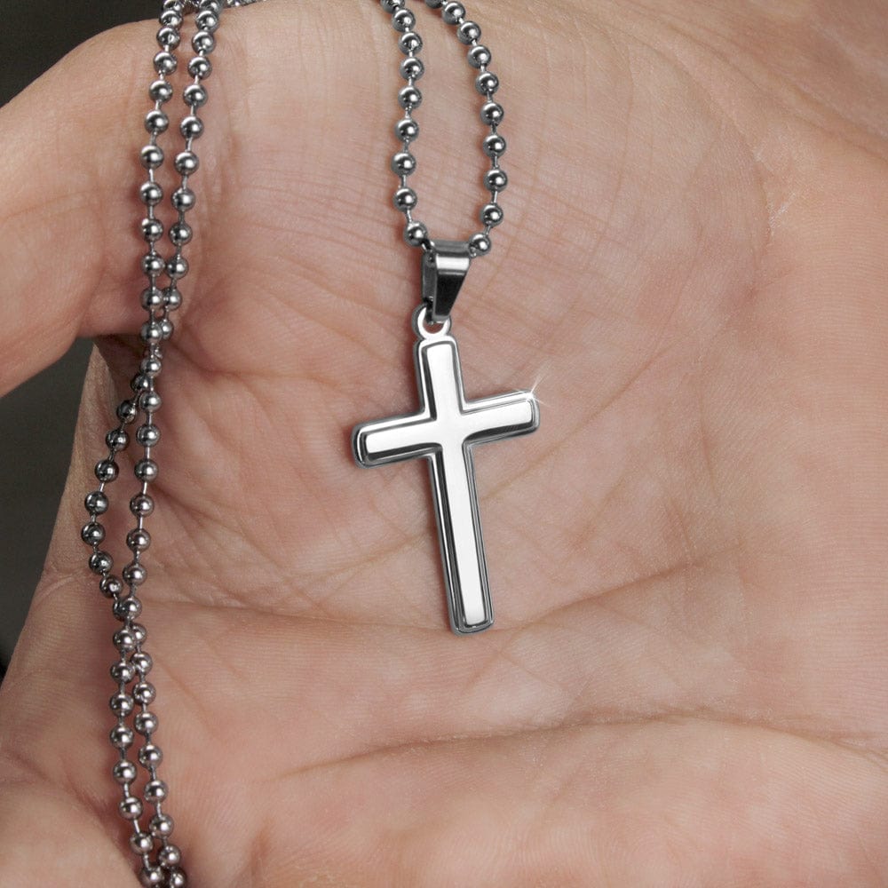 officiant prop holds hand black cross