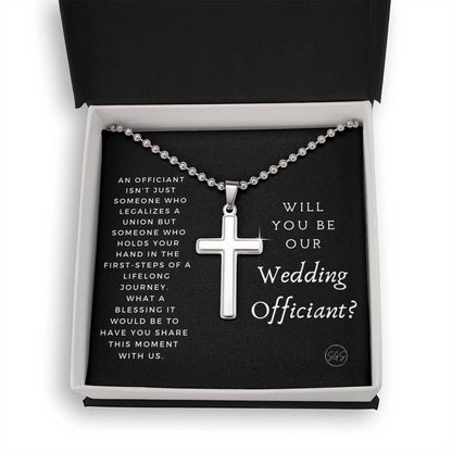 officiant prop holds hand black cross