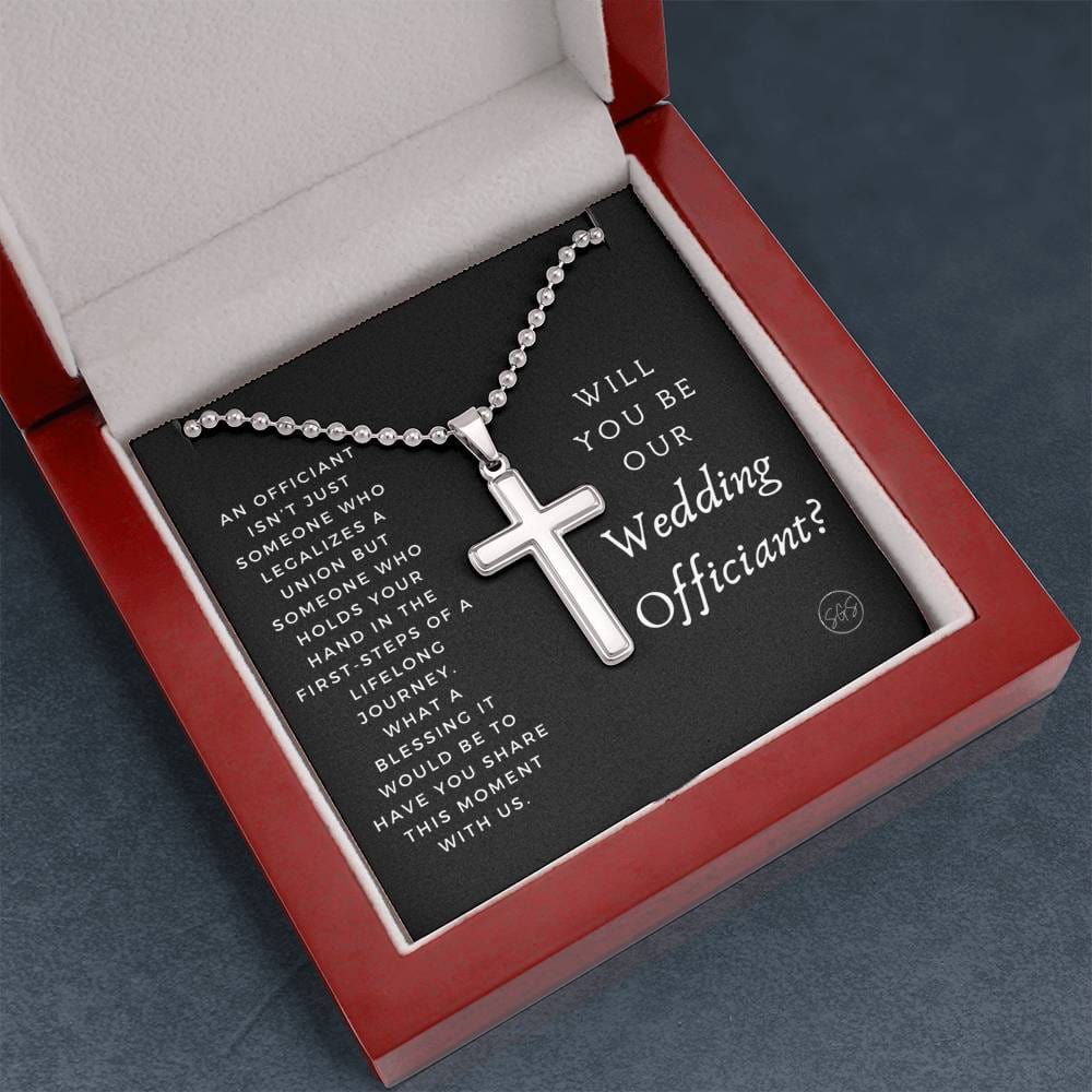 officiant prop holds hand black cross