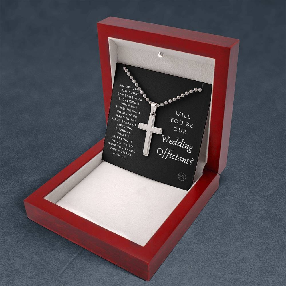 officiant prop holds hand black cross