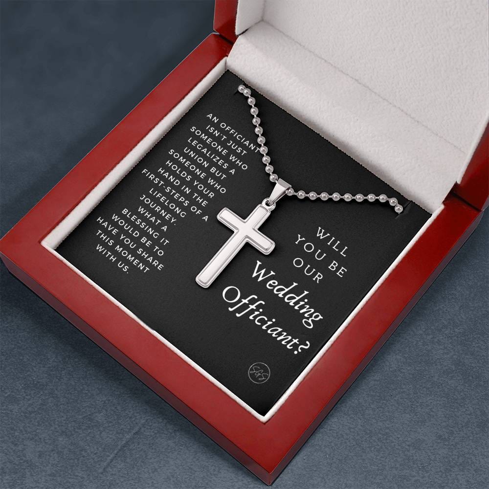 officiant prop holds hand black cross