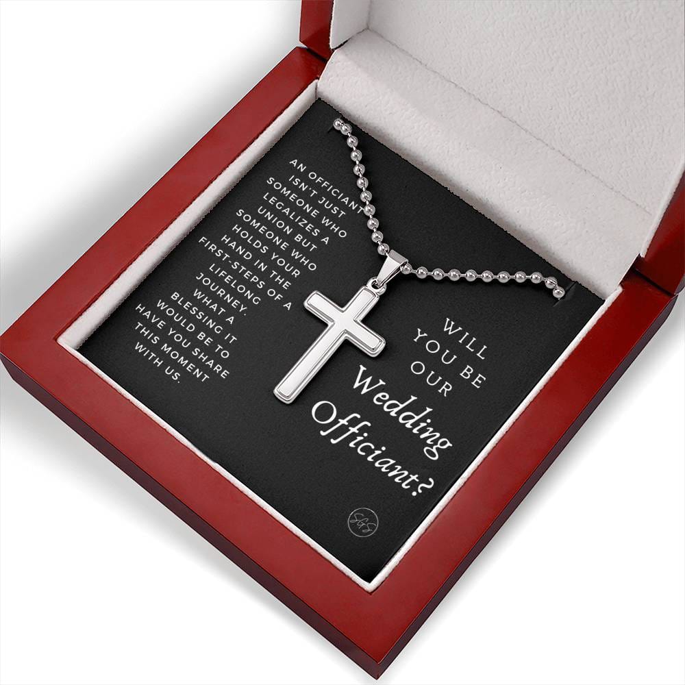 officiant prop holds hand black cross